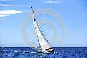 Sailing in the wind through the waves. Sailing boats at the Mediteranean sea. Nature.