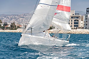 Sailing in the wind through the waves at the sea