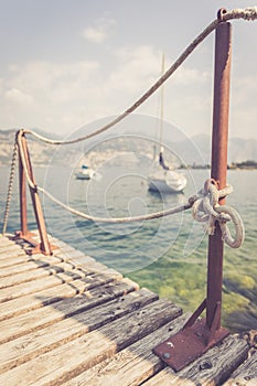 Sailing: Wooden dock pier, sailing boats in the background