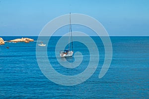 Sailing yacht in the blue sea. Ship yacht sails in the open Sea. Luxury boats. Crete, Greece. Aegean sea.