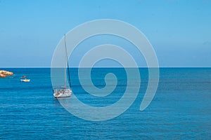 Sailing yacht in the blue sea. Ship yacht sails in the open Sea. Luxury boats. Crete, Greece.