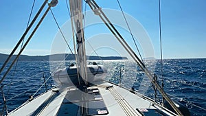 Sailing yacht boat driving on the sea on a sunny day.