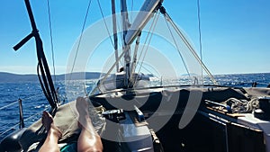 Sailing yacht boat driving on the sea on a sunny day.