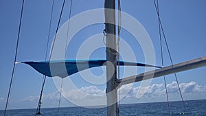 Sailing yacht catamaran sails on the waves in the warm Caribbean Sea. Sailboat. Sailing. Cancun Mexico. Summer sunny day