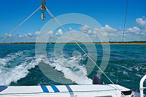 Sailing yacht catamaran sails on the waves in the warm Caribbean Sea. Sailboat. Sailing. Cancun Mexico. Summer sunny day