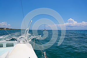 Sailing yacht catamaran sails on the waves in the warm Caribbean Sea. Sailboat. Sailing. Cancun Mexico. Summer sunny day