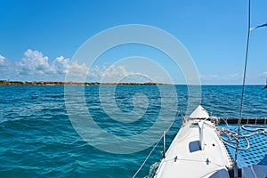 Sailing yacht catamaran sails on the waves in the warm Caribbean Sea. Sailboat. Sailing. Cancun Mexico. Summer sunny day
