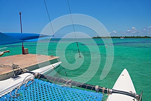 Sailing yacht catamaran sails on the waves in the warm Caribbean Sea. Sailboat. Sailing. Cancun Mexico. Summer sunny day