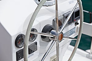 Sailing yacht control wheel and implement.