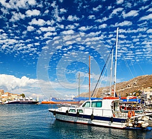 Sailing yacht at the Marina of Symi on a Sunny summer day Greece