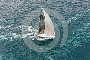 Sailing yacht race. Yachting. Sailing yacht in the sea photo