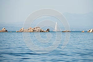 Sailing yacht newar Lavezzi Island photo