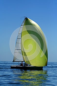 Sailing yacht with spinnaker in the wind