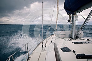 Sailing yacht during a storm, the view from the bow of the ship