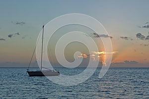 Sailing yacht and sunrise on the Pacific Ocean