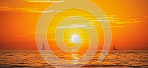 Sailing yacht on sunrise. Seascape golden sunrise over the sea, tenerife. Nature landscape. Beautiful orange and yellow