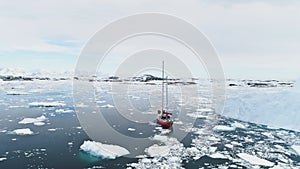 Sailing yacht travel in antarctica calm brash ice