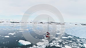 Sailing yacht travel in antarctica calm brash ice