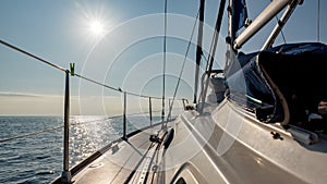 Sun over the sailing yacht photo