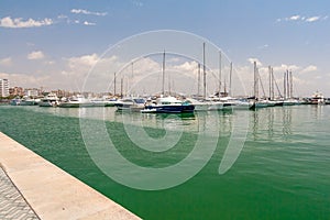 Sailing yachts and boats are in the harbor Palma de Mallorca.