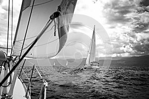 Sailing yachts in the sea in stormy weather.