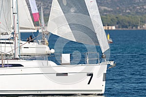 Sailing yachts with white sails in the sea