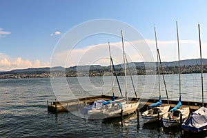 Sailingboats waiting in the port of Zug City photo
