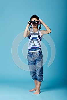 Sailor with binoculars on sky blue background