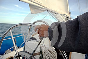 Sailor driving his sailboat