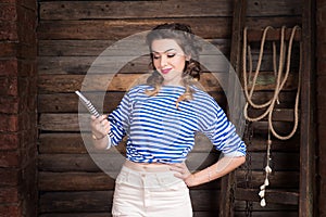 Sailor girl with striped copybook and sailor`s striped vest