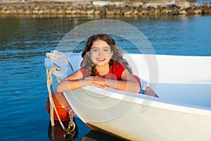 Sailor kid girl happy smiling relaxed in boat bow