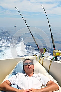 Sailor man fishing resting in boat summer vacation