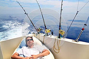 Sailor man fishing resting in boat summer vacation