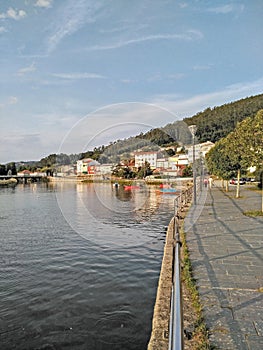 Sailor town, bridge and river with boats