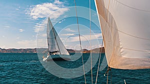 Sailors boats participate in sailing regatta in the Aegean Sea. Sport.