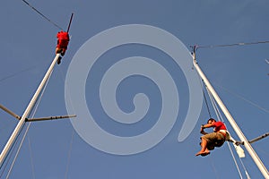 Sailors climbing mast