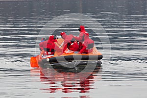 Sailors in an emergency life boat photo