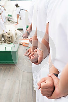 Sailors in Line with Hands Behind Backs Attention White Uniforms