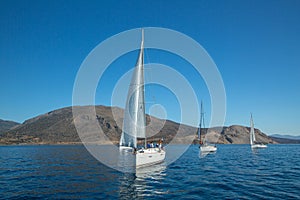 Sailors participate in sailing regatta 12th Ellada Autumn 2014 among Greek island group in the Aegean Sea
