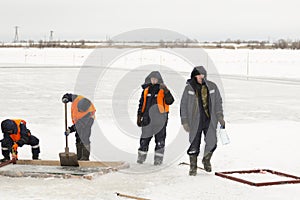 Sailors work at the lane with a fenced wooden formwork