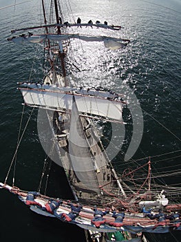 Sailors working aloft in a huge tallship, crazy perspective