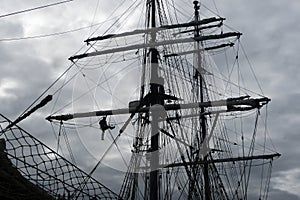 Sailors working aloft in the rigging, traditional tallship