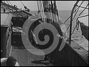 Sailors working on ship in open sea