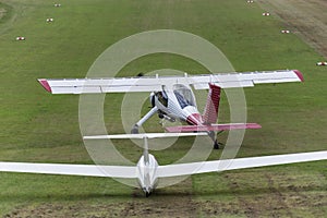 Sailplane and a towing aircraft starting on an airfield photo