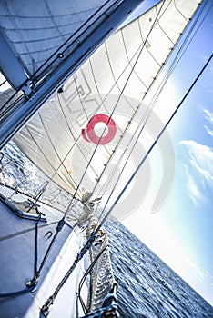 Sails on a sailboat at sea in the north of summer.