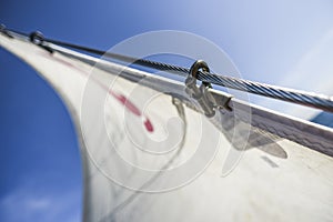 Sails on a sailboat at sea in the north of summer.