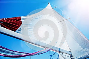 Sails of a sailing yacht in the wind