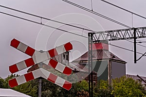 Saint Andrew\'s Cross. Old industrial buildings and trees can be seen in the background.