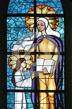 Saint Anne, Education of the Virgin Mary, stained glass window at Our Lady of Miracles Church in Ostarije, Croatia