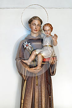 Saint Anthony holds a child of Jesus, a statue in the church of Saint Anthony of Padua in Zagreb, Croatia